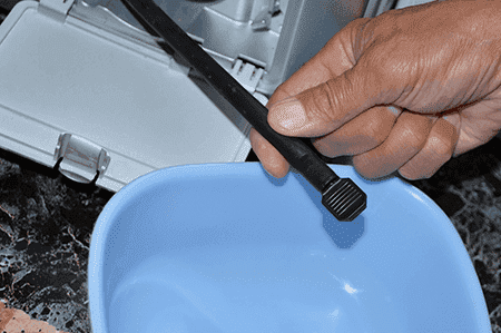 How to drain water from the washing machine through an emergency drain